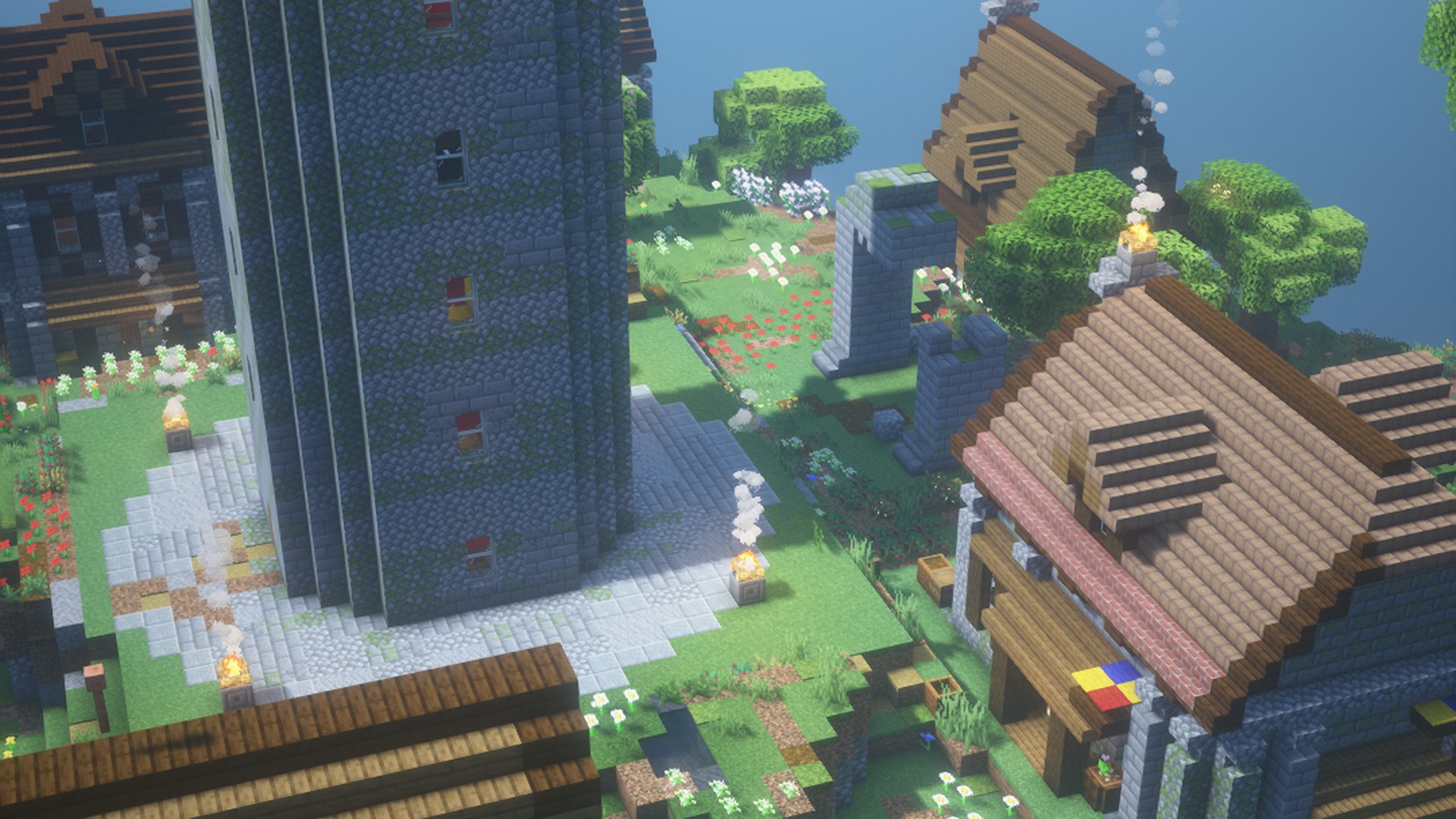 A tall weathered stone watch tower on a crag island with houses around it