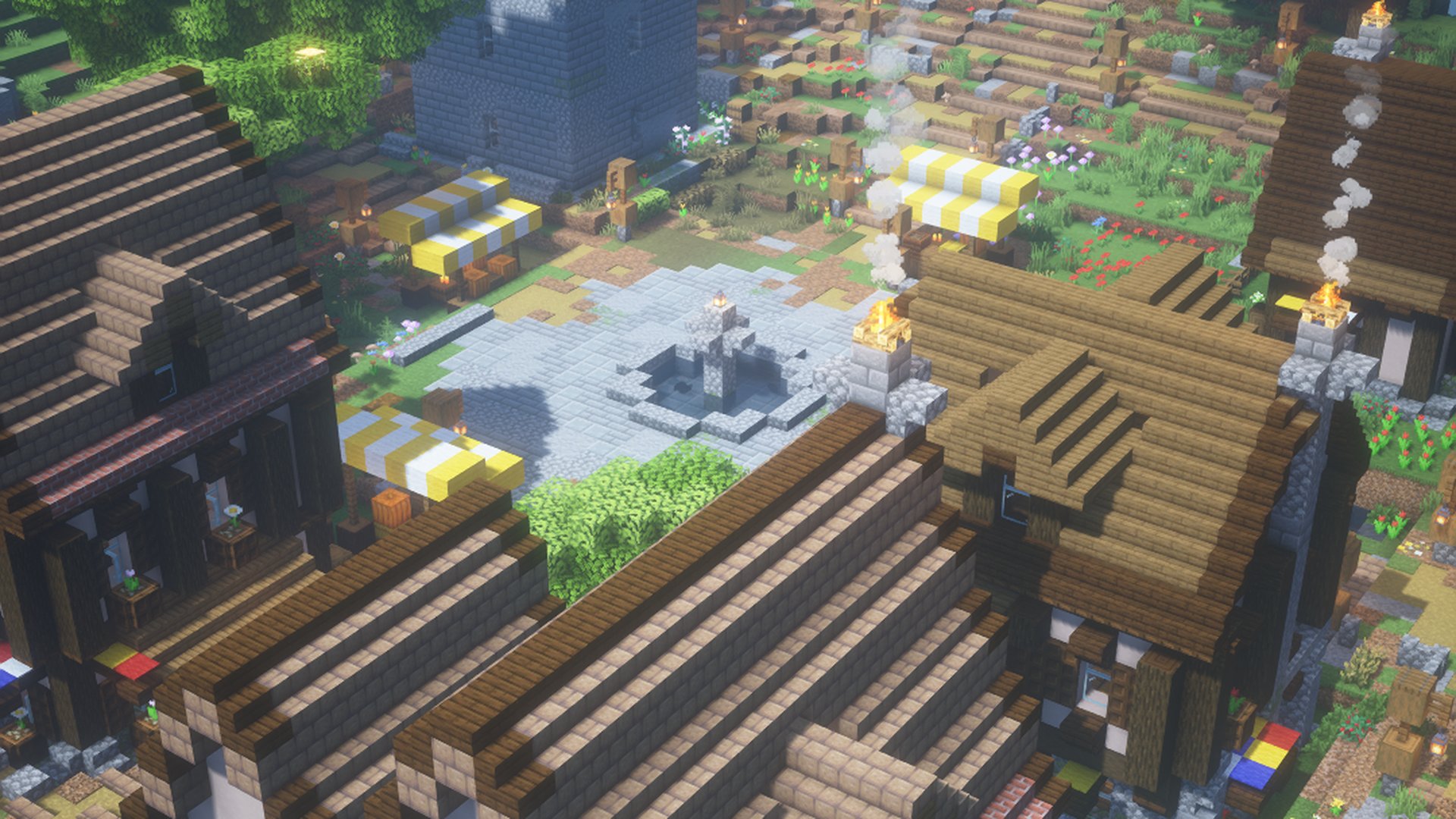 A medieval town square with a stone fountain, market stalls and timber houses