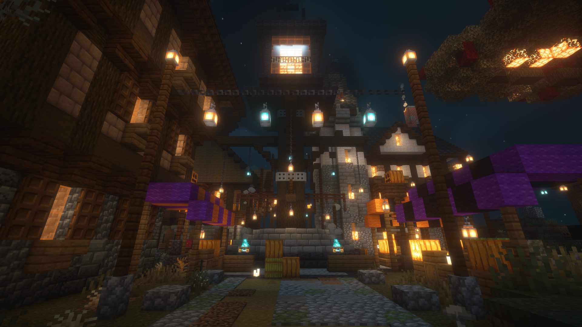 The market road at night under strings of lanterns