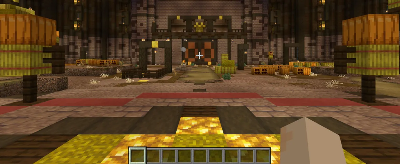 A timber hall with pumpkins and fences seen in Minecraft Bedrock